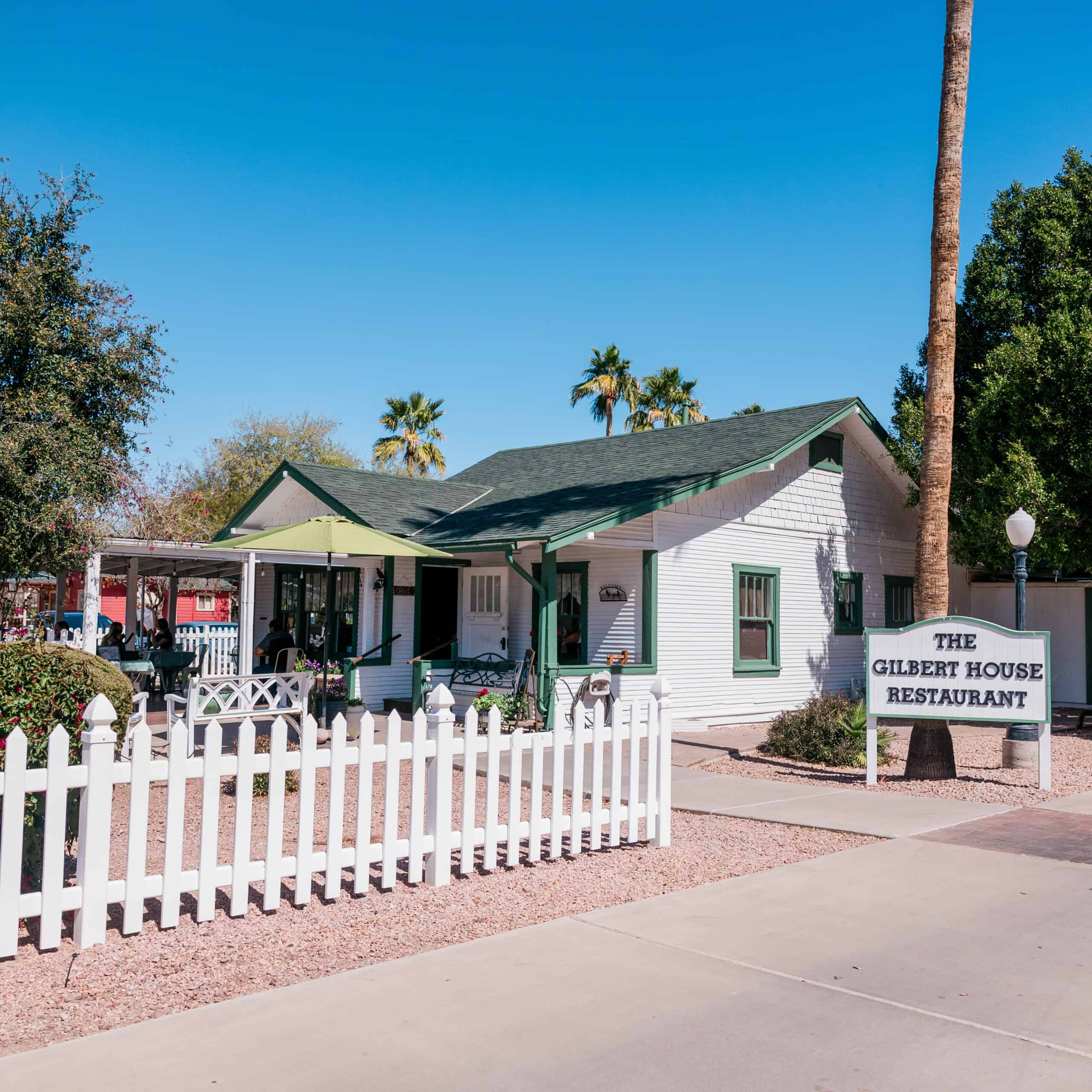 Charming outdoor venue at Gilbert House Restaurant perfect for private parties, gatherings, and celebrations in a cozy setting with beautiful landscaping and seating areas.